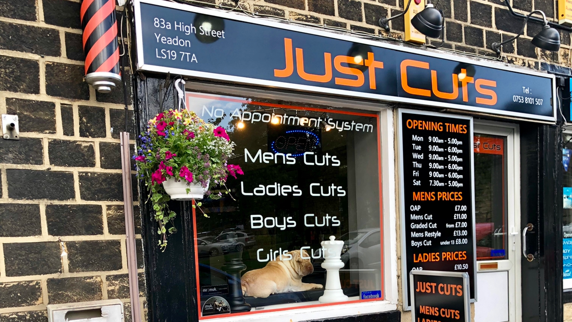 Our orange Just Cuts sign and shopfront at 83a High Street, Yeadon